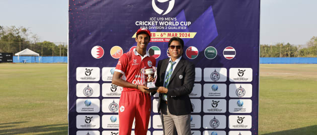 Oman team with the trophy